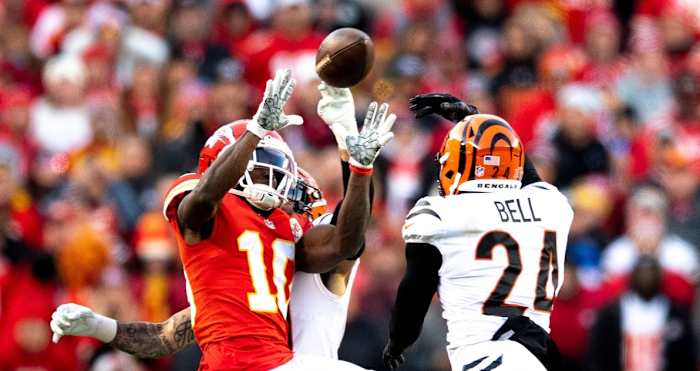 Cincinnati Bengals free safety Jessie Bates (30) knocks the ball away from Kansas City Chiefs wide receiver Tyreek Hill (10) and Cincinnati Bengals safety Vonn Bell (24) intercepts it in overtime of the AFC championship NFL football game, Sunday, Jan. 30, 2022, at GEHA Field at Arrowhead Stadium in Kansas City, Mo. Cincinnati Bengals defeated Kansas City Chiefs 27-24. Cincinnati Bengals At Kansas City Chiefs Jan 30 Afc Championship 103